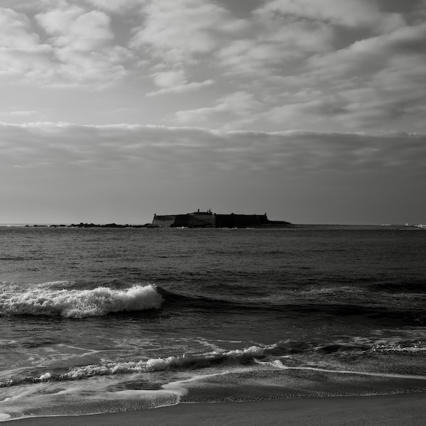 Fort in a island in the ocean seen from the shore. Caminha, Portugal - 2024